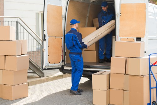 Professional packers carefully organizing belongings