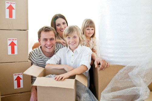 Packing team organizing boxes for a move in Mortlake
