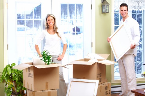 Professional movers handling furniture